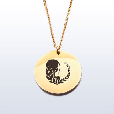 Virgo gold pendant symbolizing the sun.